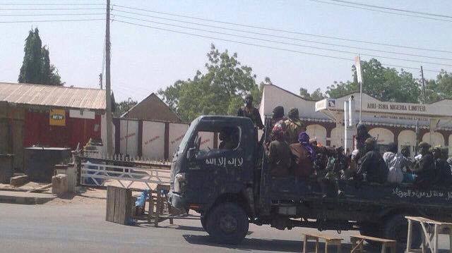 Boko Haram making a quick run to distribute anti-voting flyers in Gombe town last week