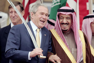 Saudi Arabia's Prince Salman Bin Abdul Aziz (R), brother of King Abdullah, next to former US president George W. Bush (L) laughing it up. {Img PressTv}