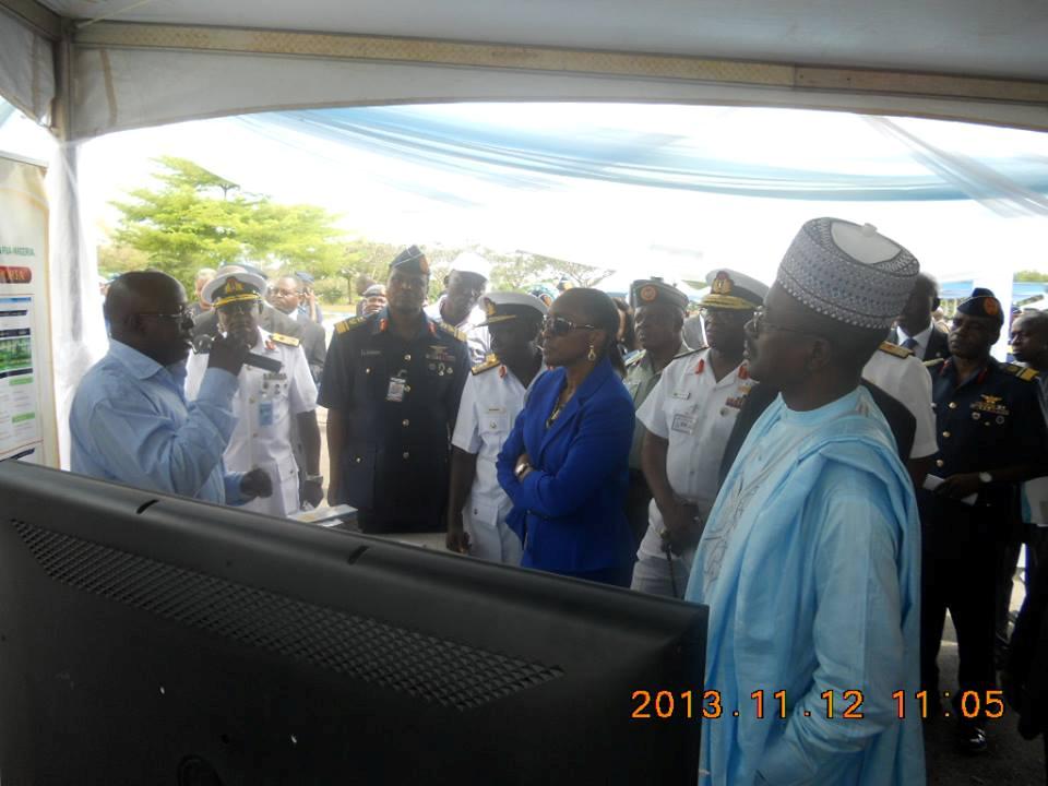 Team’s Spokesman, Mr David B. Barau, Ag. Head Web Application Development Unit, ICT Directorate ABU and one of the  Team Leads, ABU Software Committee, briefs Ministers of Information, Communication and Technology and top military chiefs who called at the ABU Software Development committee grotto at the first Nigeria Airforce Inter-Command Competition & Most Innovative R&D Exhibition, at NAF Base Abuja (Nov 12, 2013).
