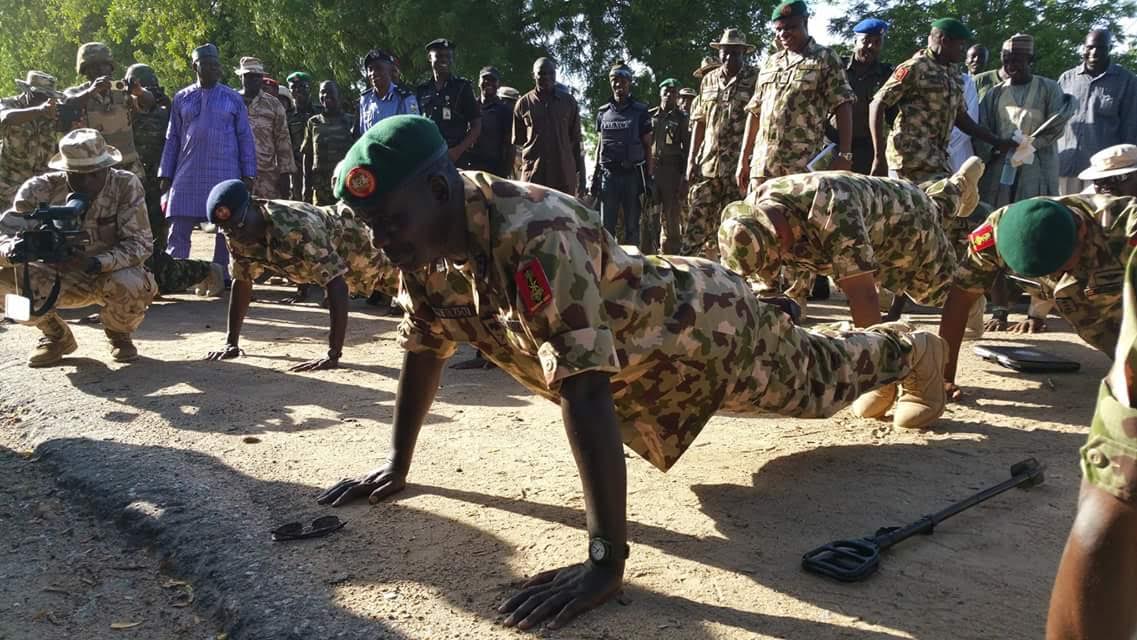 Buratai doing push-ups with the troops