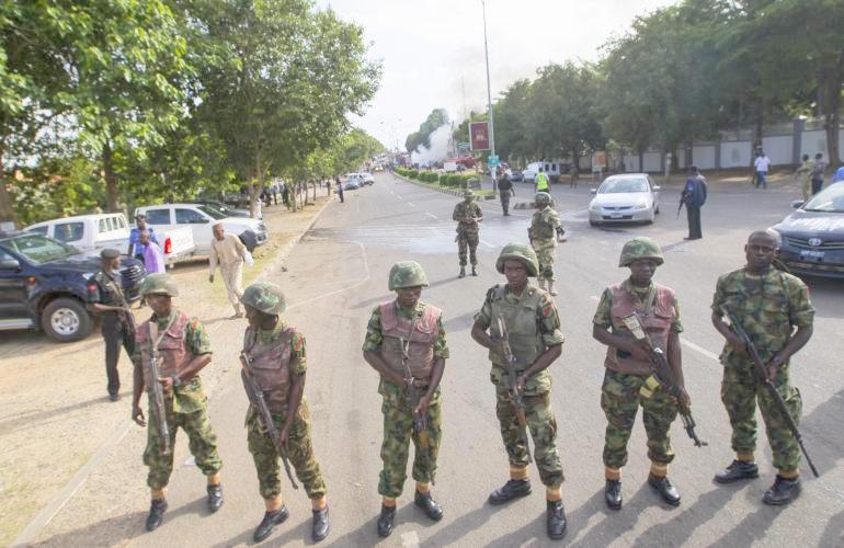 Troops stormed the railway police station, Umuahia in the Abia State capital monday and whisked away the divisional police officer (DPO) and another policemen after raining blows on them following the arrest of an army captain for parking his bus at an unauthorised place close to the station.