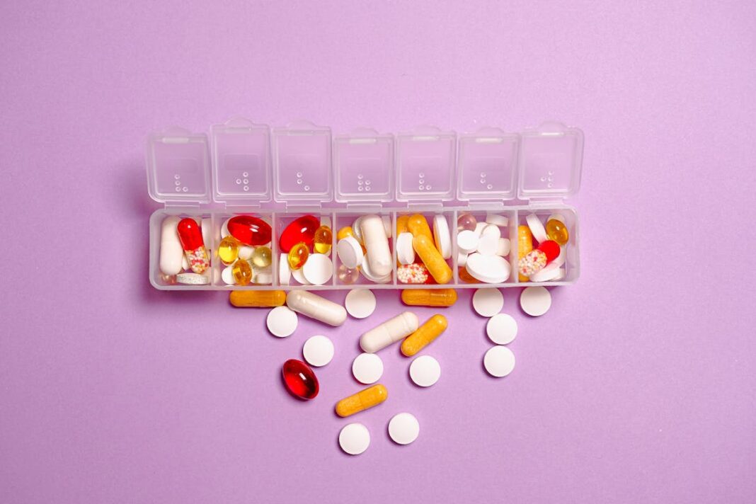 Vitamin D supplements and natural sunlight on a wooden surface