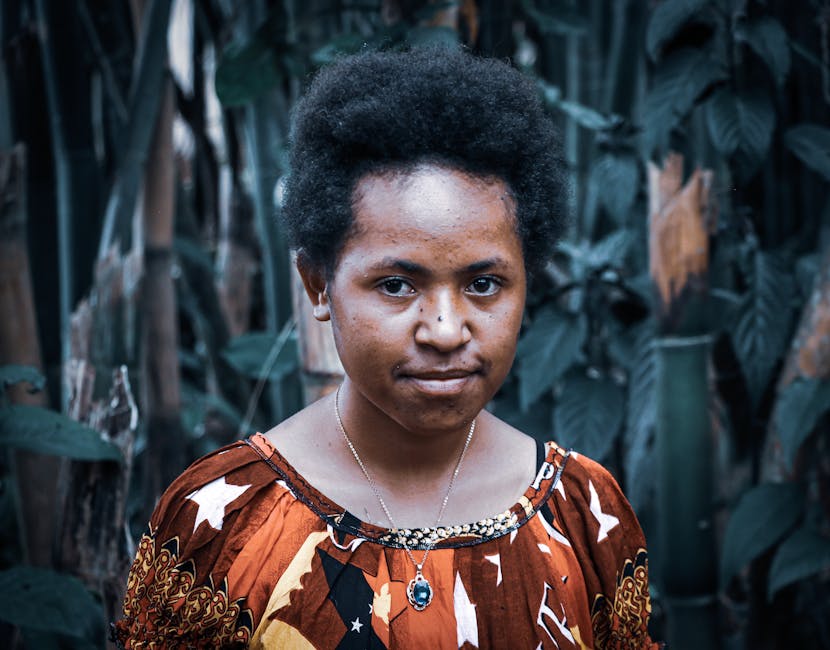 A vibrant portrait of a woman in traditional clothing in Papua New Guinea.